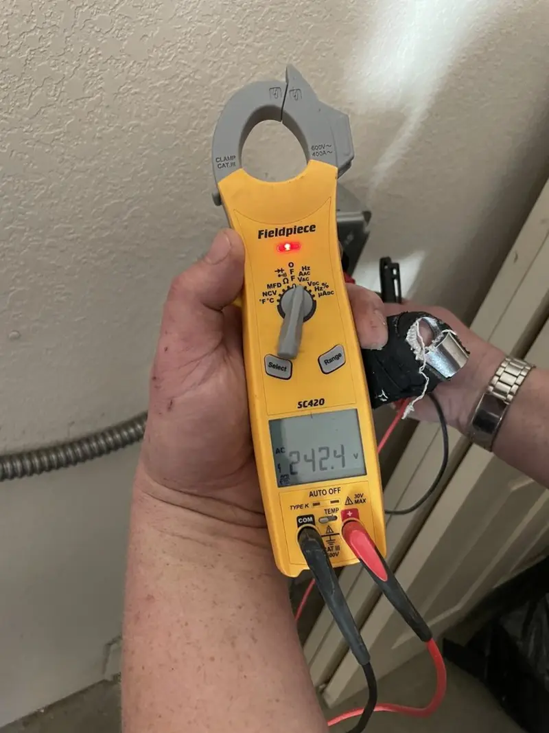 Voltage testing with clamp meter during Outlet Installation in Prairieville